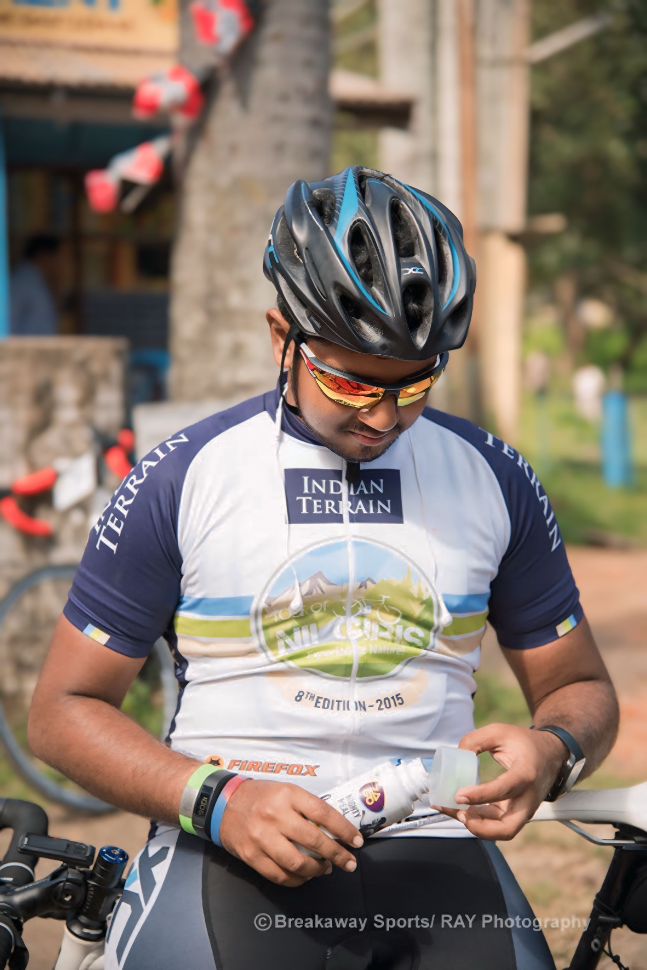 Rider in a Tour of Nilgiris 2015 jersey preparing at the start line