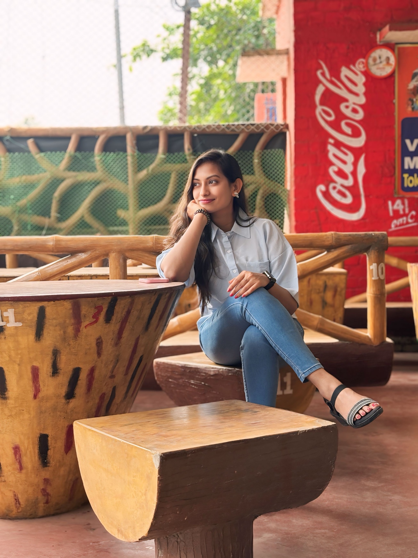 Portrait session in warm afternoon light at an open-air cafe